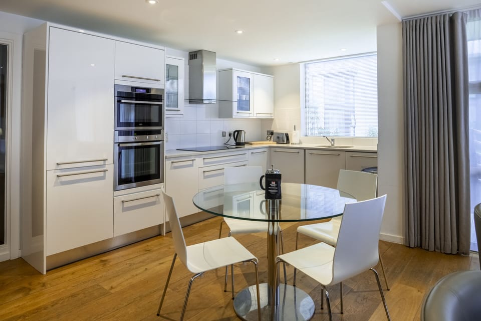 Two Bedroom Luxury Apartment | Private kitchen | Electric kettle, toaster, dining tables