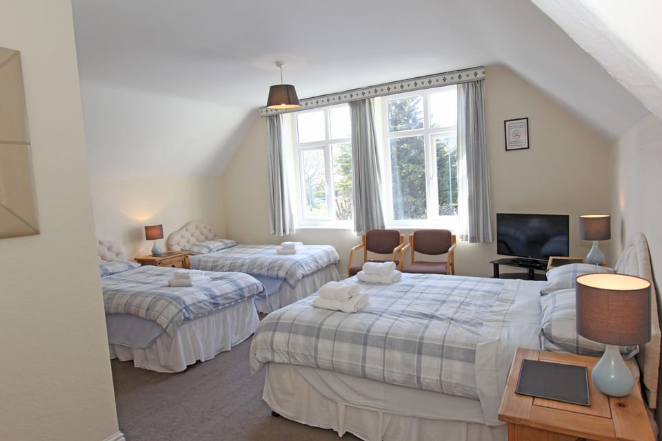 Family Room (2 Adults + 2 Children Second Floor) | Blackout drapes, free WiFi, bed sheets
