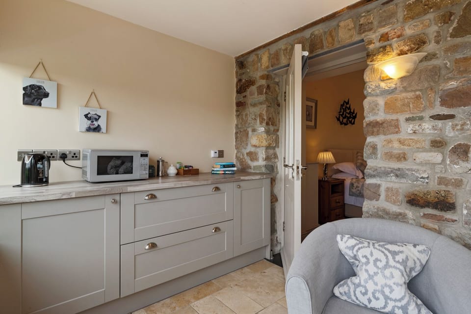 Luxury Suite, 1 King Bed, Mountain View | Living area | Flat-screen TV, heated floors