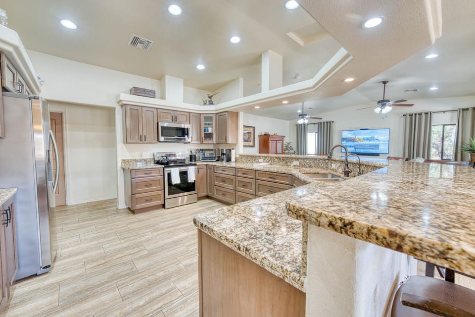 Spacious, functional kitchen with a bar-top & all the essentials. 