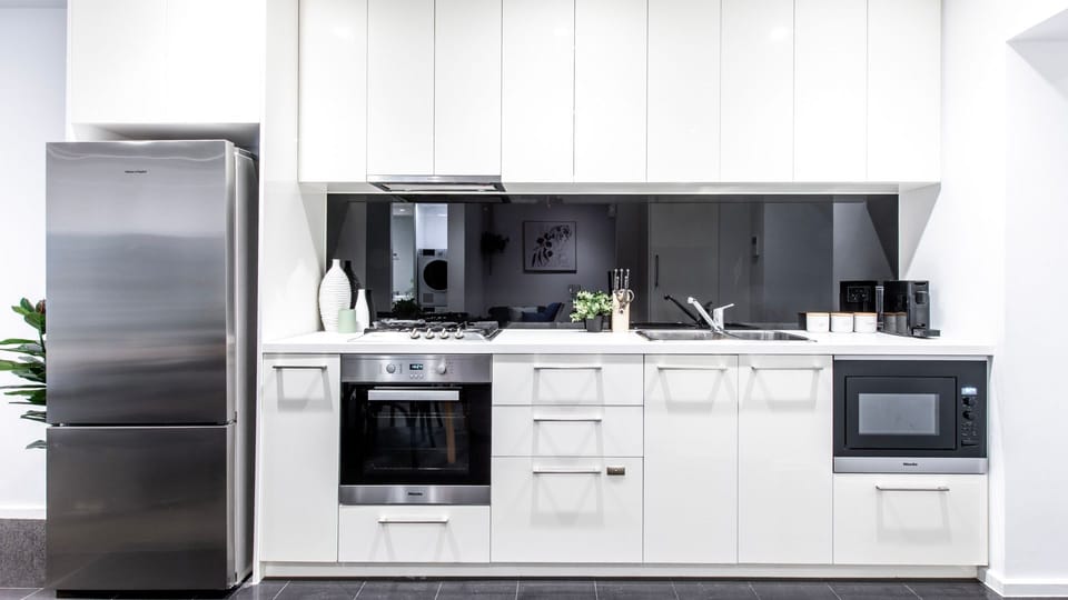 Sleek fully equipped kitchen with premium modern appliances.