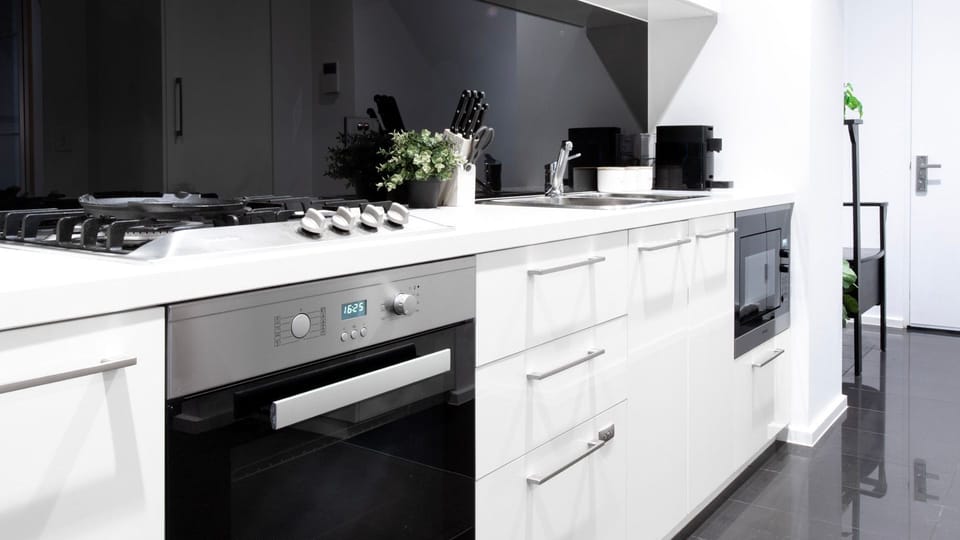 Stylish culinary space with crisp cabinetry and elegant finishes.