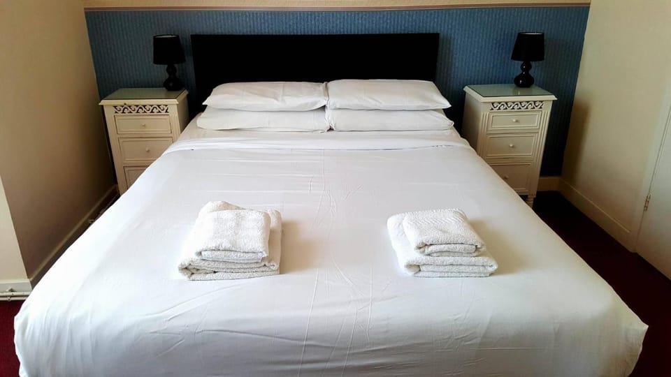 Desk, blackout drapes, WiFi (free), bed sheets