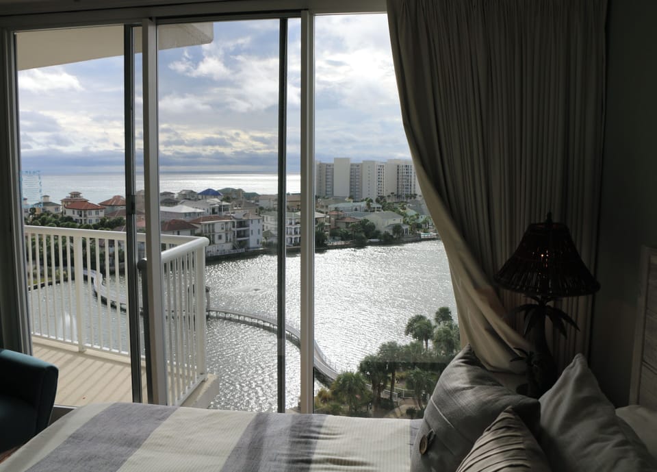 silver views of the sea and lake from your bed at mid afternoon.