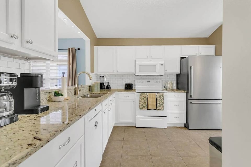 Cook and gather in this fully equipped kitchen. From brand-new appliances to sparkling cookware, utensils, and every detail has been thoughtfully provided to make cooking a breeze. This kitchen has it all—just bring your ingredients and inspiration.
