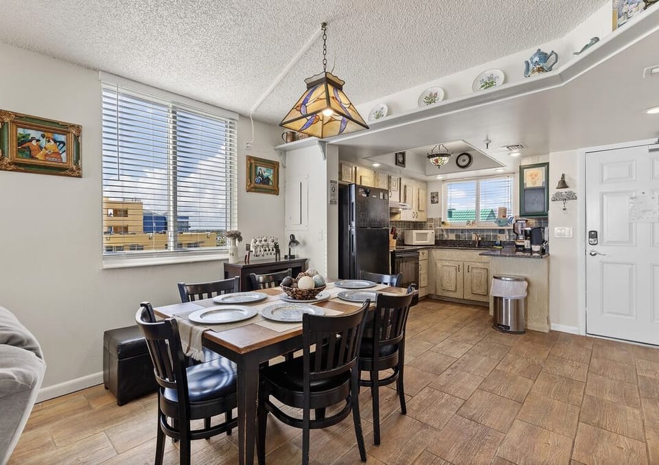 Enjoy family meals in this beach condo's inviting dining space with seating for six. A fully equipped kitchen makes your beach stay easy and convenient for cooking and entertaining.