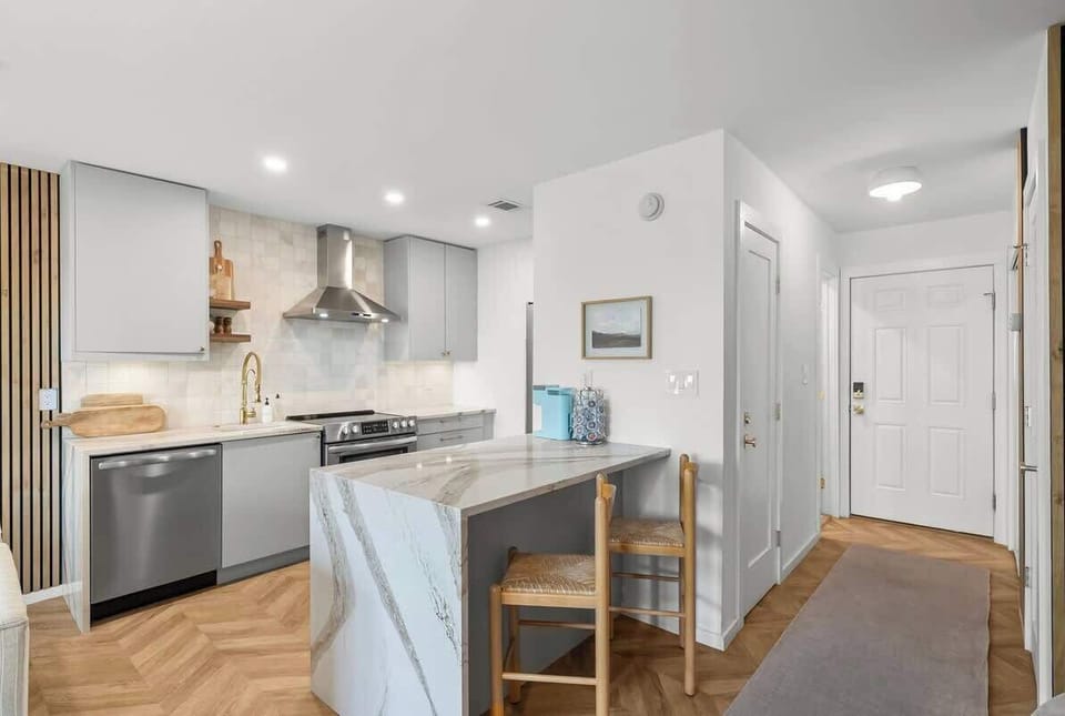 Studio features a fully stocked kitchen & island seating for 2.