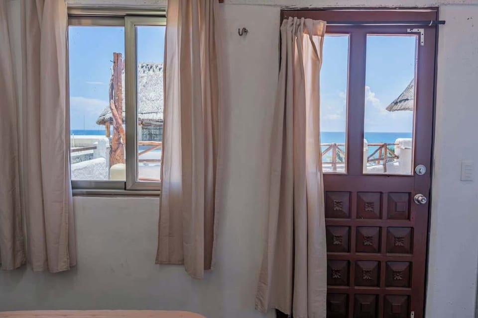 Bright studio interior with sea-view window