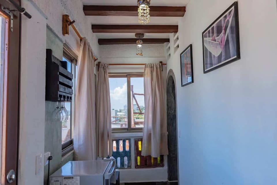 Studio interior with wood-beam ceiling