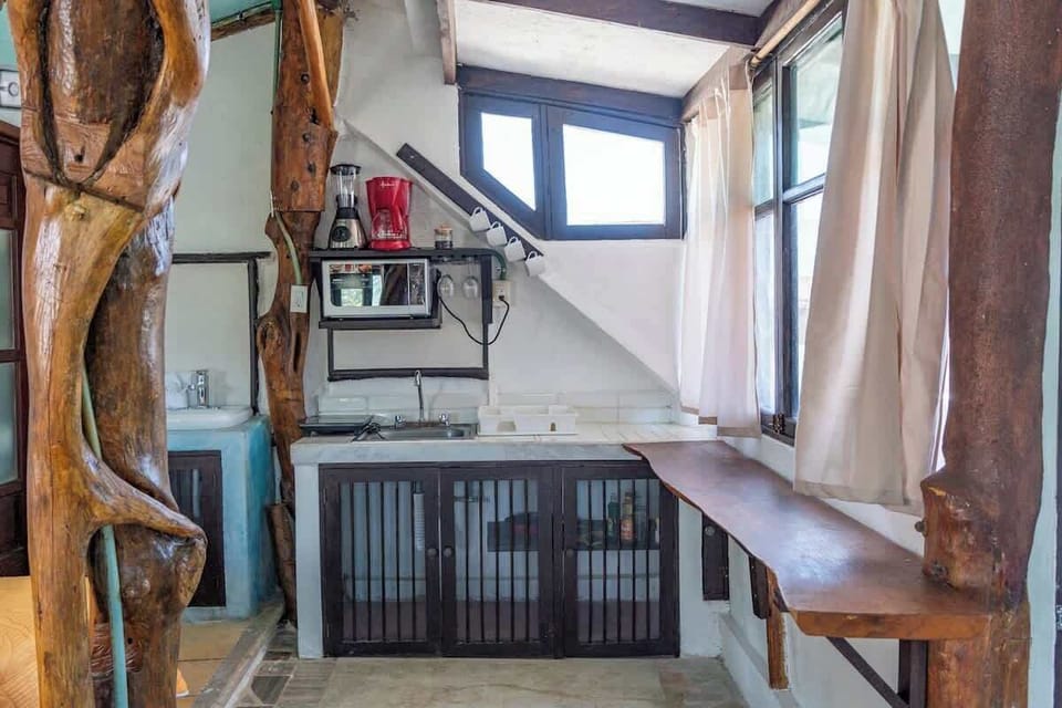 Sleeping area with double bed and window