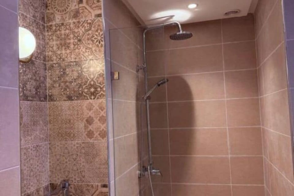 Shower, slippers, towels, soap