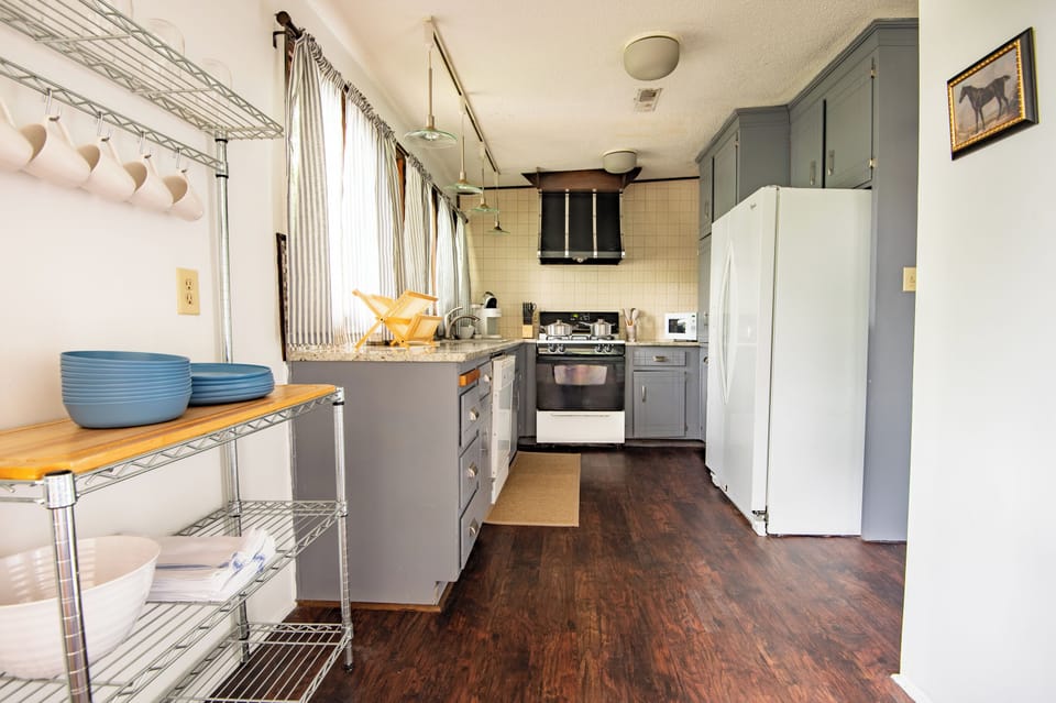 Fully equipped kitchen with updated appliances – Cook and dine easily in this well-stocked, open kitchen.