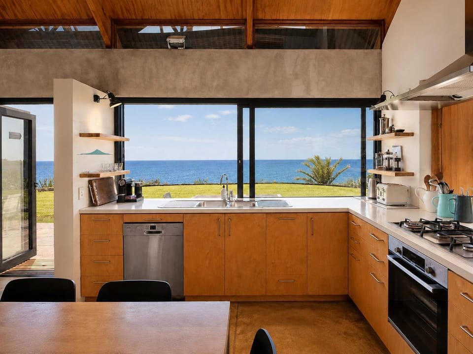 Kitchen with large sliding window for easy outdoor entertaining 