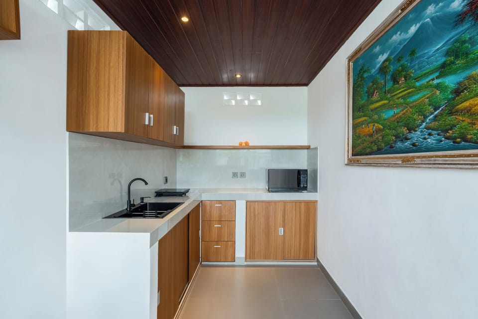 Deluxe Villa, Balcony, Pool View | Private kitchen | Mini-fridge, microwave, stovetop, electric kettle