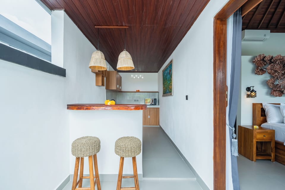 Deluxe Villa, Balcony, Pool View | Private kitchen | Mini-fridge, microwave, stovetop, electric kettle