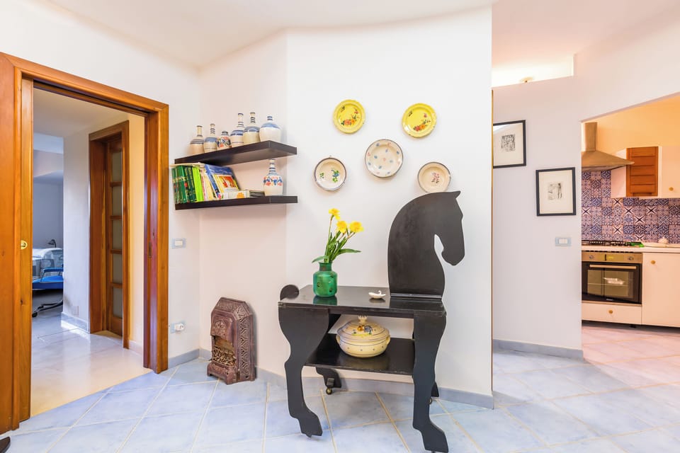 Apartment (1 Bedroom) | Living area | 32-inch Smart TV with cable channels