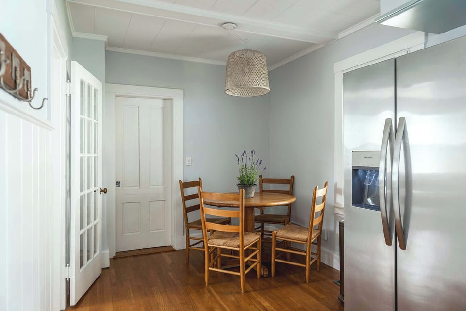 Breakfast nook with stainless appliances and pendant lighting
