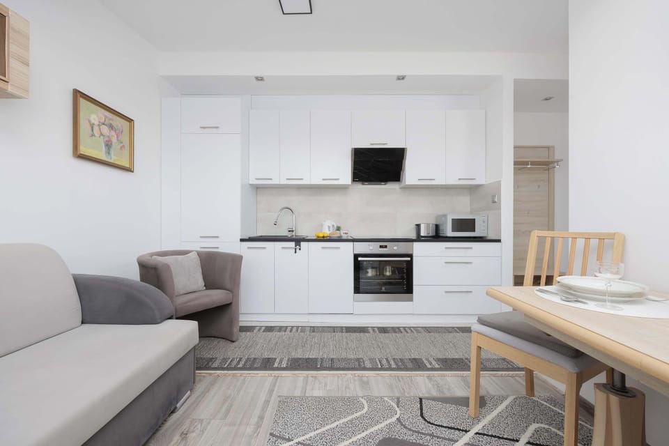 Cook and dine in style with the modern kitchenette and dining area.