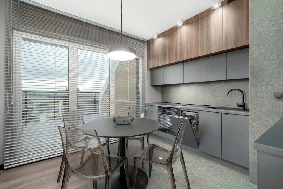 Kitchenette with oven and refrigerator. 