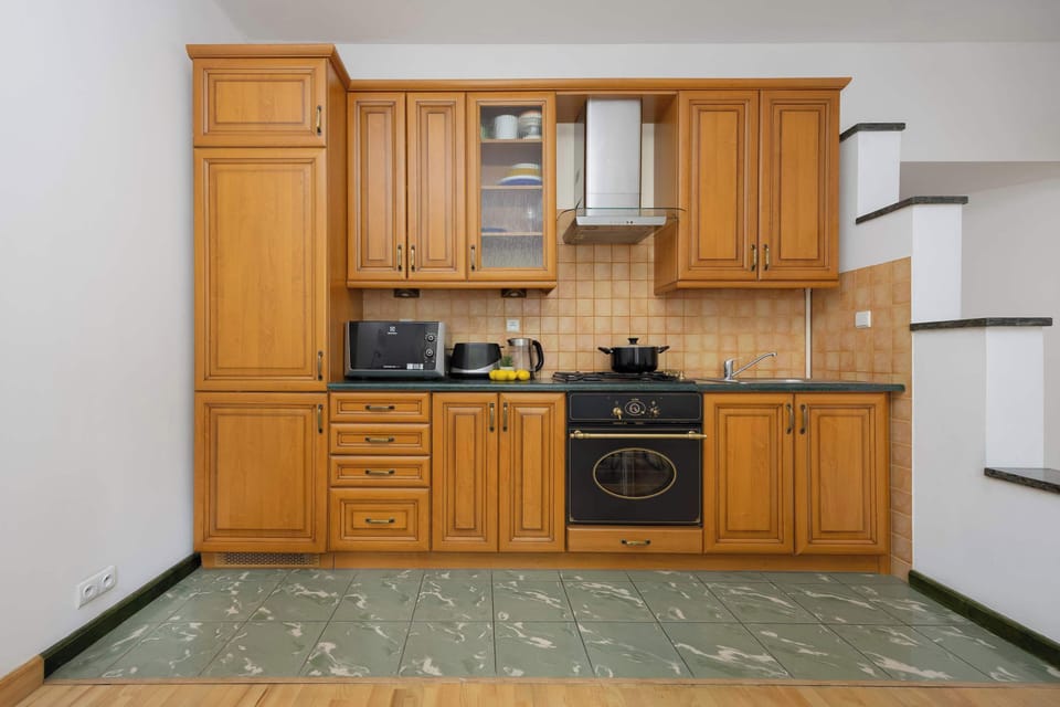 The sleek design of the kitchenette blending seamlessly with the living area.
