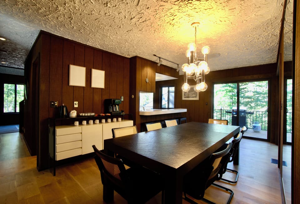  Dining table seats 8 under elegant chandelier