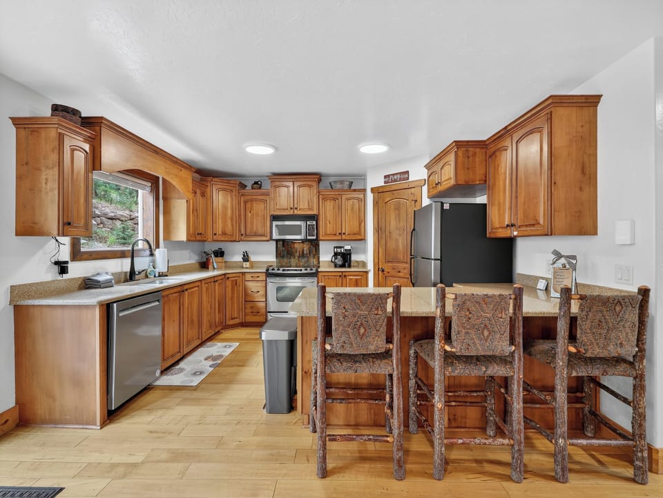 View of the fully stocked kitchen with everything you need for cooking and dining on the mountain