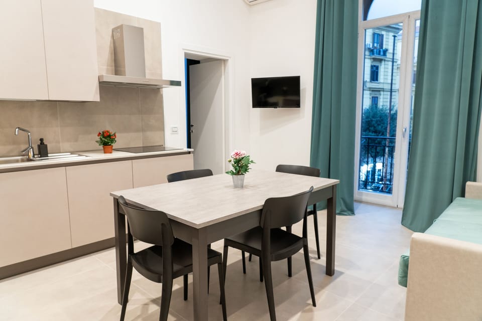 Deluxe Apartment, Balcony, City View | Living area | TV