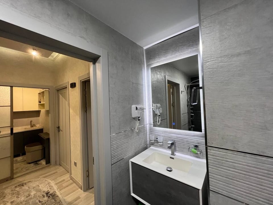 Shower, free toiletries, hair dryer, slippers