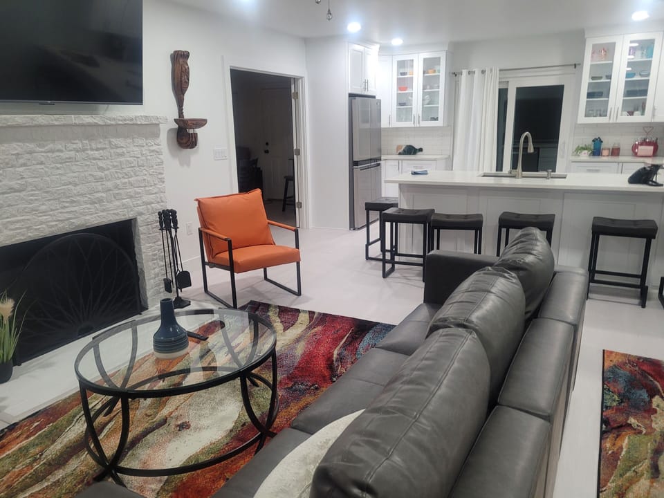 Living room and kitchen.  Door on left leads to dining room.