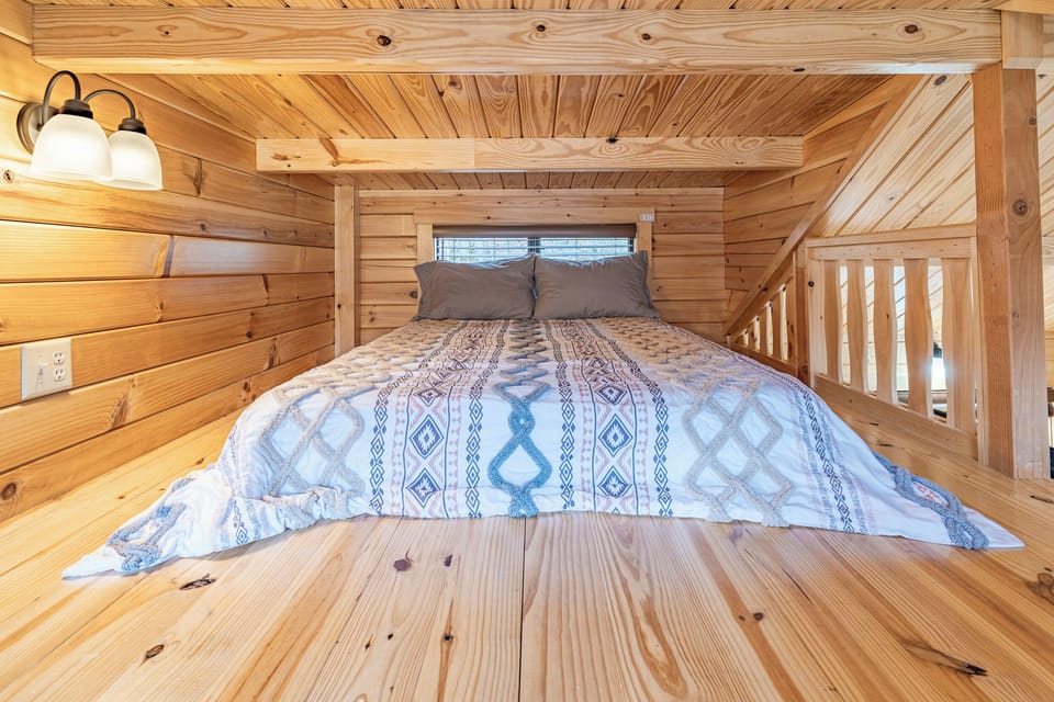 Climb on up to the Loft! Complete with a full sized bed, sheets, pillows and comforter.