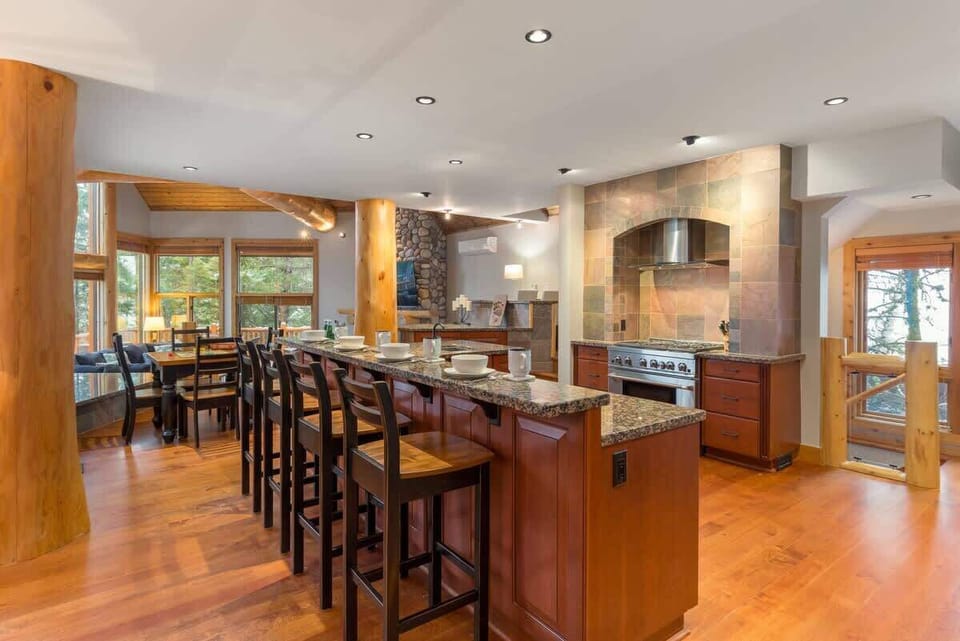 Open kitchen w/ long island seating, ideal for cooking together or casual bites