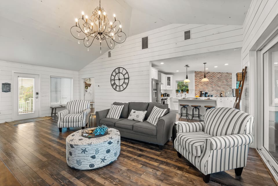 Stylish space featuring ocean views, elegant decor, and ample seating 