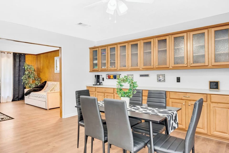 Plenty of cabinets and dining space around the kitchen .
