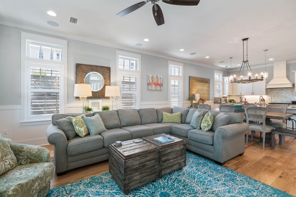 Comfortable sectional sofa with easy access to the kitchen and dining area.