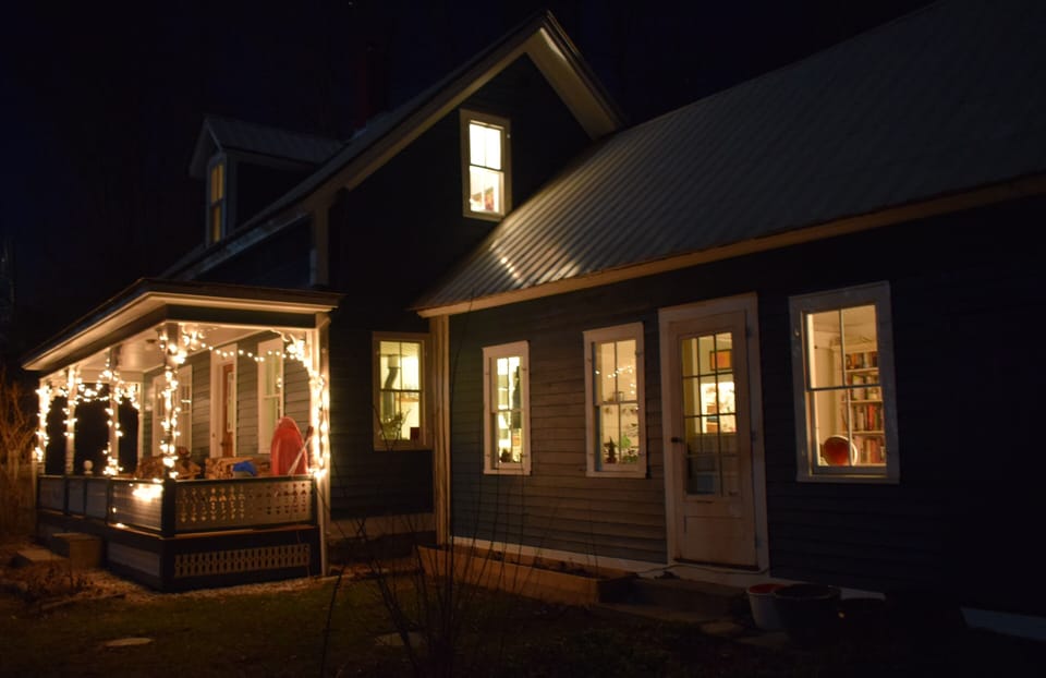 Front of house at night.
