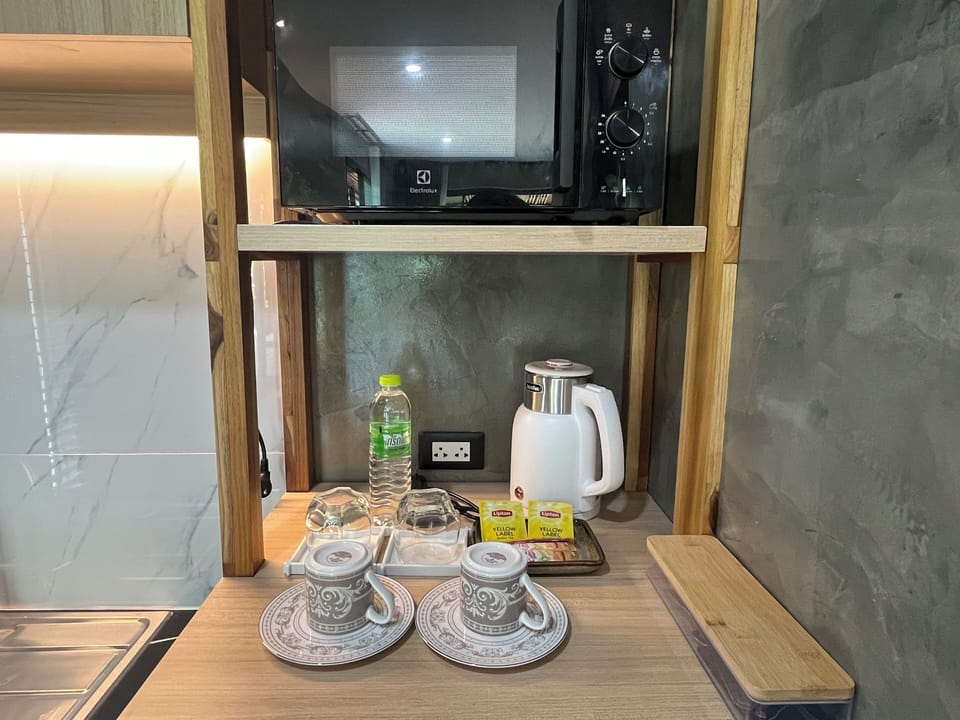 Deluxe Suite, River View | Coffee and/or coffee maker