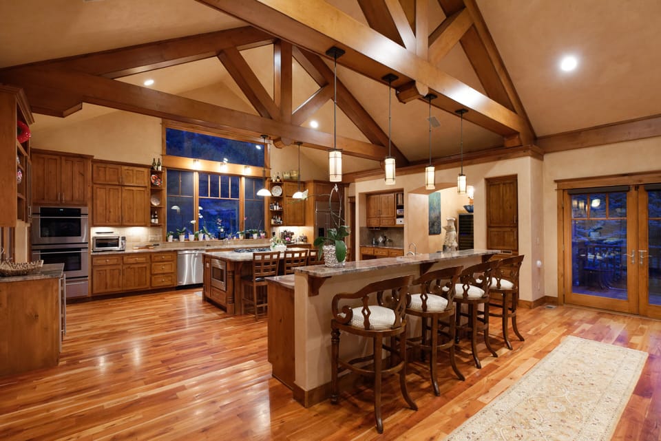 Open floor plan view of kitchen and two seating bar areas