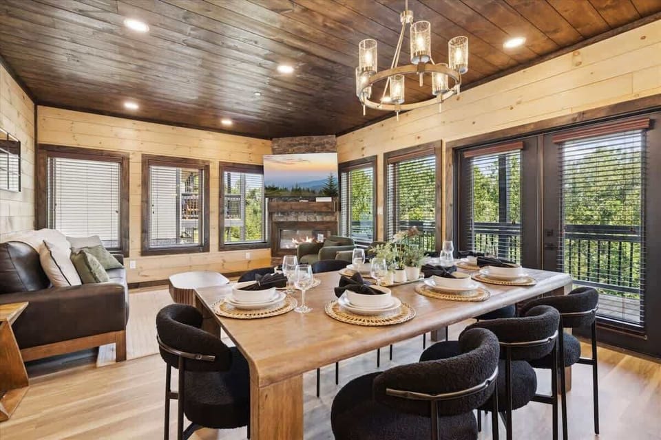 Enjoy stunning views while sharing delightful meals around the rustic wooden table!