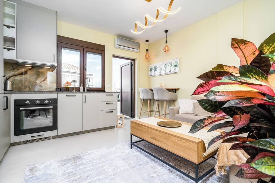 Livingroom together with kitchen, provided with an air condition unit for cooling or heating the place.