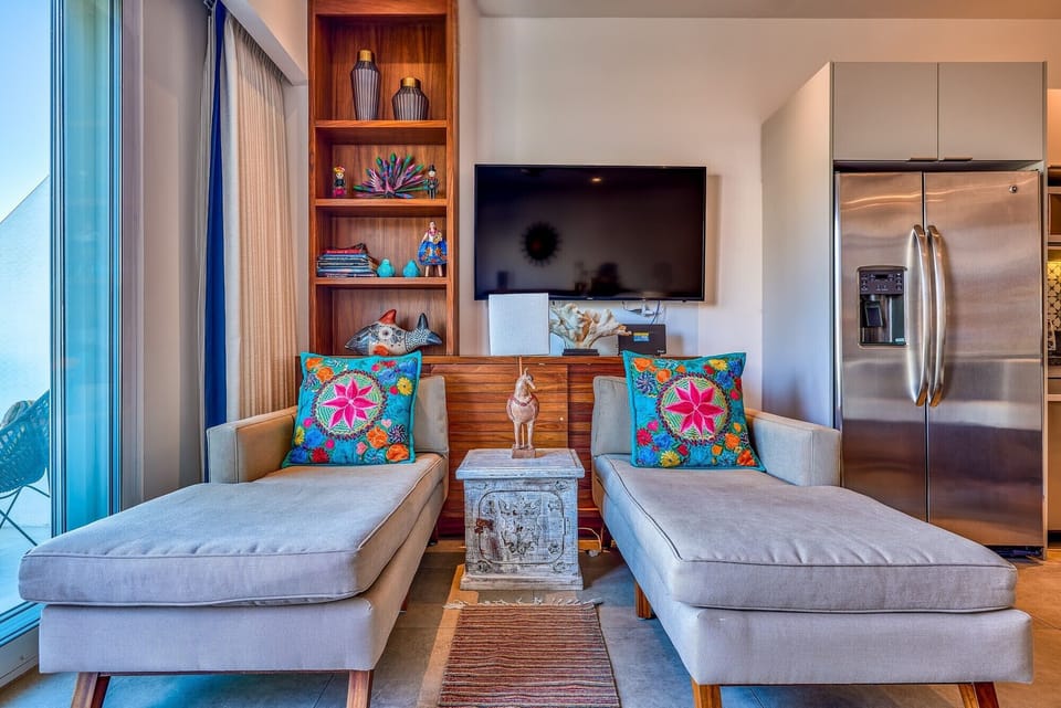 The living area combines modern comfort with colorful Mexican accents.
