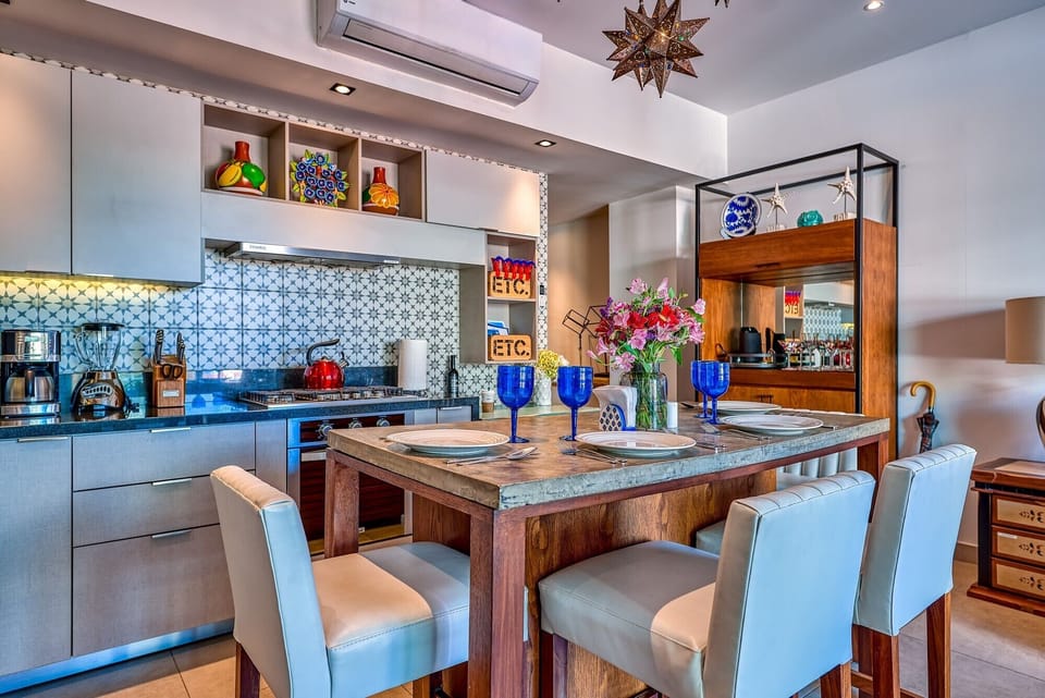 Sleek kitchen with island and seating for four