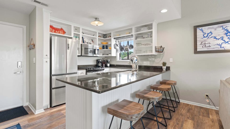 Sip morning coffee or grab a bite at the kitchen counter, seating 4​