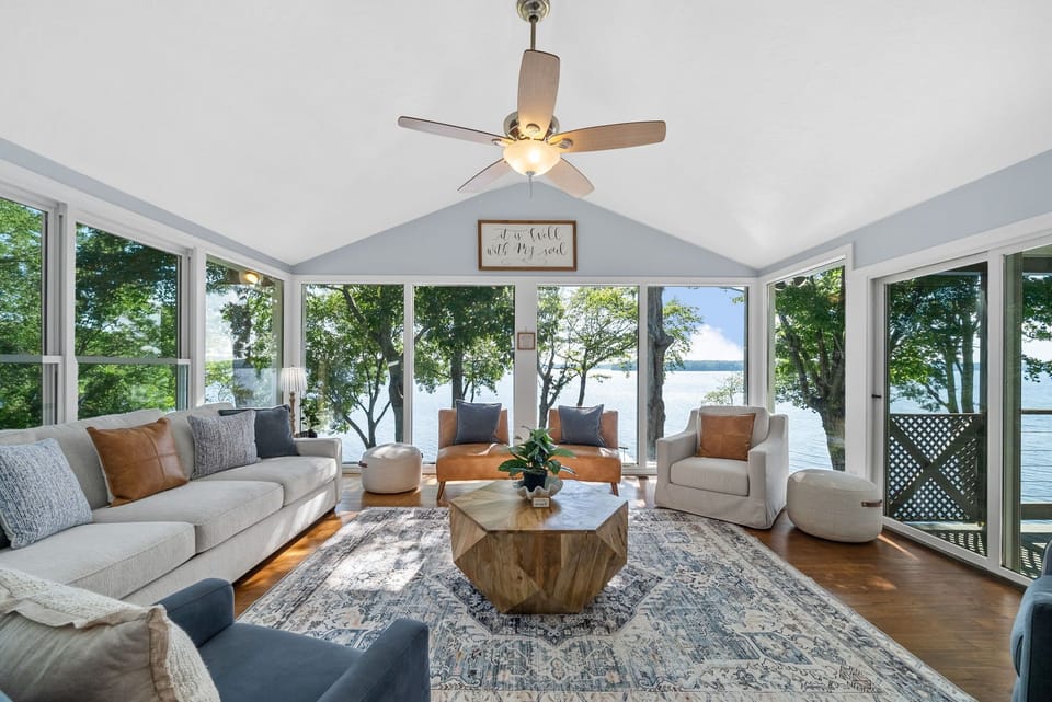 Relax in a sunny lakeside room with calming views and comfy furnishings.