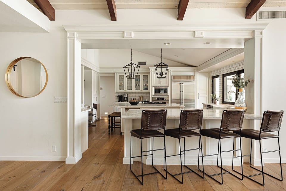 Living rooms flows into the chefs kitchen