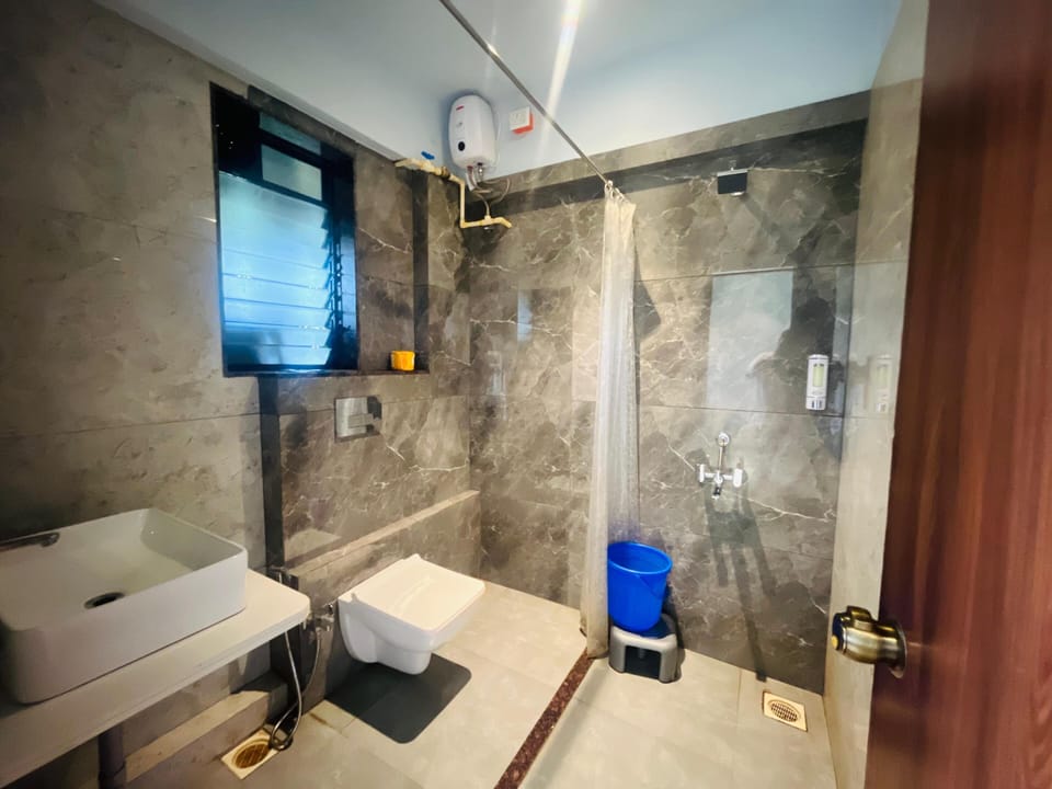 Shower, free toiletries, hair dryer, slippers