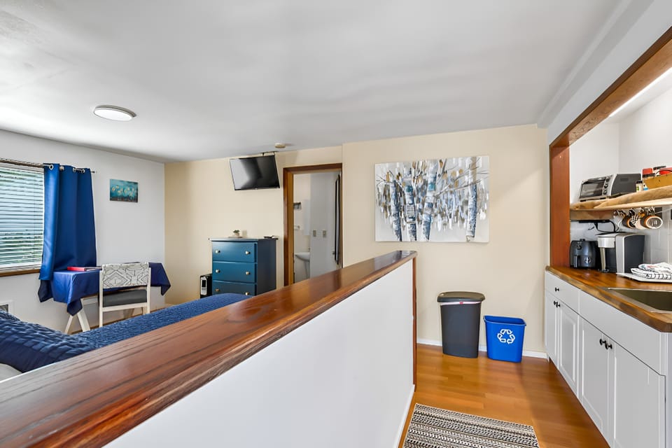 As you enter, the kitchenette is on your right and the sleeping, living space is on your left.   