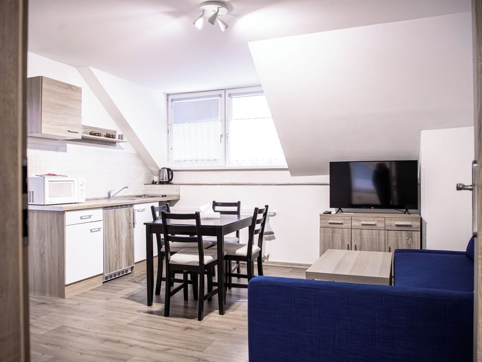 Suite, Balcony, Courtyard View | Living area | TV