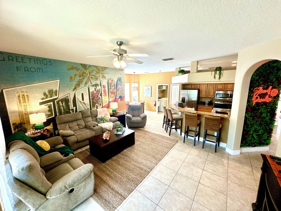 Relax in the family room in the reclining chairs or watch a movie on the 55" TV