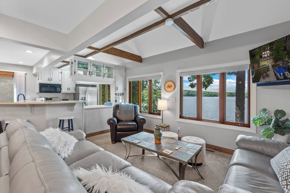 Airy open-concept space connecting the kitchen and living room.