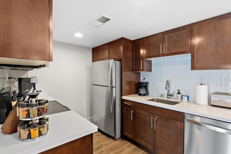 Fully equipped culinary space with brand-new stainless steel appliances.